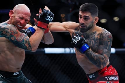 Ilia Topuria lands a punch on Josh Emmett in a featherweight bout during the UFC Fight Night event Saturday, June 24, 2023 at VyStar Veterans Memorial Arena in Jacksonville, Fla. Ilia Topuria defeated Josh Emmett by unanimous decision in five rounds.