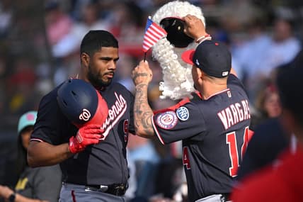 Jun 24, 2023; San Diego, California, USA; Washington Nationals third baseman Jeimer Candelario (9) is greeted at the dugout by shortstop Ildemaro Vargas (14) after hitting a home run against the San Diego Padres during the first inning at Petco Park. Mandatory Credit: Orlando Ramirez-USA TODAY Sports