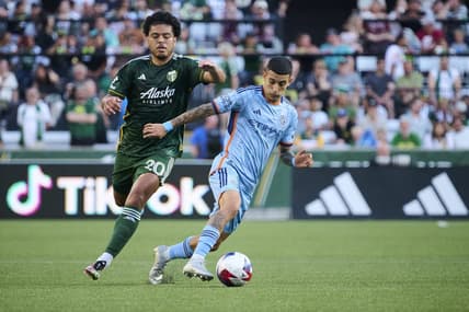 Jun 24, 2023; Portland, Oregon, USA; New York City midfielder Santiago Rodriguez (10) controls the ball during the first half against Portland Timbers midfielder Evander (20) at Providence Park. Mandatory Credit: Troy Wayrynen-USA TODAY Sports