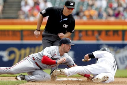 Jun 25, 2023; Detroit, Michigan, USA; Detroit Tigers third baseman Nick Maton (9) is tagged out by Minnesota Twins third baseman Kyle Farmer (12) trying to steal second in the fourth inning at Comerica Park. Mandatory Credit: Rick Osentoski-USA TODAY Sports