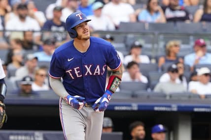 Jun 25, 2023; Bronx, New York, USA; Texas Rangers catcher Jonah Heim (28) watches his home run against the New York Yankees during the second inning at Yankee Stadium. Mandatory Credit: Gregory Fisher-USA TODAY Sports