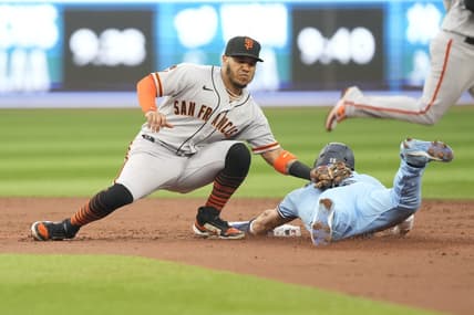 Jun 27, 2023; Toronto, Ontario, CAN; San Francisco Giants second baseman Thairo Estrada (39) catches Toronto Blue Jays left fielder Whit Merrifield (15) trying to steal second base during the second inning at Rogers Centre. Mandatory Credit: John E. Sokolowski-USA TODAY Sports