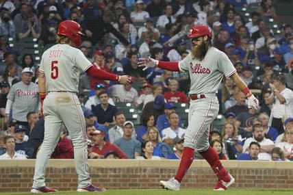 Jun 27, 2023; Chicago, Illinois, USA; Philadelphia Phillies center fielder Brandon Marsh (16) is greeted by second baseman Bryson Stott (5) after hitting a two-run homer against the Chicago Cubs during the fifth inning at Wrigley Field. Mandatory Credit: David Banks-USA TODAY Sports