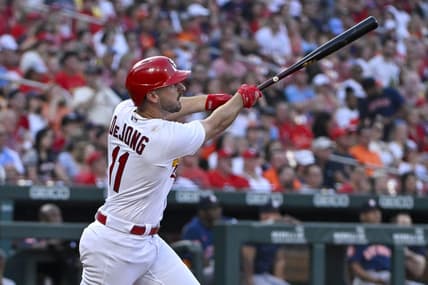 Jun 27, 2023; St. Louis, Missouri, USA;  St. Louis Cardinals shortstop Paul DeJong (11) hits a one run sacrifice fly against the Houston Astros during the fourth inning at Busch Stadium. Mandatory Credit: Jeff Curry-USA TODAY Sports