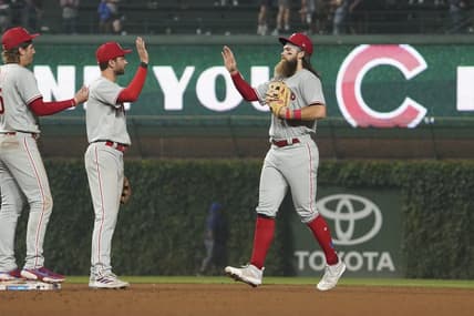 Jun 27, 2023; Chicago, Illinois, USA; Philadelphia Phillies center fielder Brandon Marsh (right) and shortstop Trea Turner (center) react after defeating the Chicago Cubs at Wrigley Field. Mandatory Credit: David Banks-USA TODAY Sports