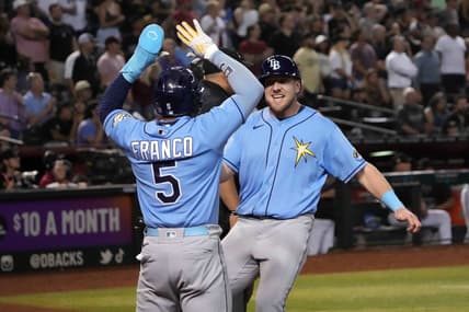 Jun 28, 2023; Phoenix, Arizona, USA; Tampa Bay Rays right fielder Luke Raley (55) and Tampa Bay Rays shortstop Wander Franco (5) celebrate after scoring runs against the Arizona Diamondbacks during the ninth inning at Chase Field. Mandatory Credit: Joe Camporeale-USA TODAY Sports
