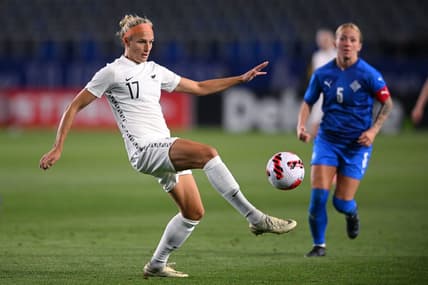 Feb 17, 2022; Carson, California, USA; New Zealand forward Hannah Wilkinson (17) passes the ball ahead of Iceland midfielder Gunnhildur Yrsa Jonsdottir (5) in the second half during a 2022 SheBelieves Cup international soccer match at Dignity Health Sports Park. Mandatory Credit: Orlando Ramirez-USA TODAY Sports