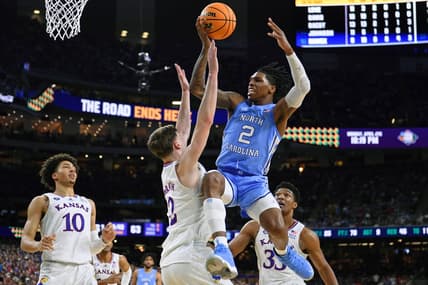 Apr 4, 2022; New Orleans, LA, USA; North Carolina Tar Heels guard Caleb Love (2) loses control of the ball while defended by Kansas Jayhawks guard Christian Braun (2) during the second half during the 2022 NCAA men's basketball tournament Final Four championship game at Caesars Superdome. Mandatory Credit: Bob Donnan-USA TODAY Sports