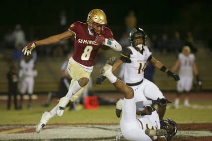 Florida High junior Micahi Danzy (8) leaps through the air in the Class 2S state semifinal matchup between Florida High and Bishop Verot on Dec. 2, 2022, at Mike Hickman Stadium. The Seminoles won, 38-28.

J9t8323