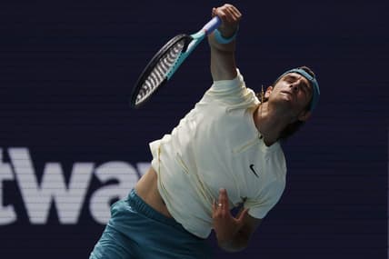 Mar 25, 2023; Miami, Florida, US; Lorenzo Musetti (ITA) serves against Jiri Lehechka (CZE) (not pictured) on day six of the Miami Open at Hard Rock Stadium. Mandatory Credit: Geoff Burke-USA TODAY Sports