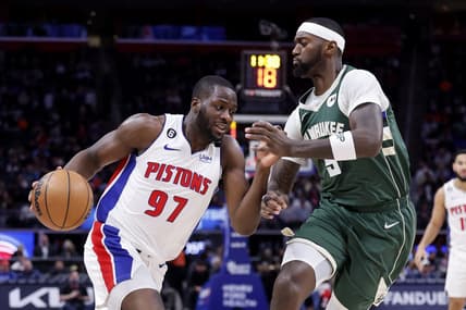 Mar 27, 2023; Detroit, Michigan, USA;  Detroit Pistons forward Eugene Omoruyi (97) dribbles on Milwaukee Bucks forward Bobby Portis (9) in the first half at Little Caesars Arena. Mandatory Credit: Rick Osentoski-USA TODAY Sports