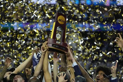 Apr 3, 2023; Houston, TX, USA; Connecticut Huskies players celebrate after defeating the San Diego State Aztecs in the national championship game of the 2023 NCAA Tournament at NRG Stadium. Mandatory Credit: Bob Donnan-USA TODAY Sports