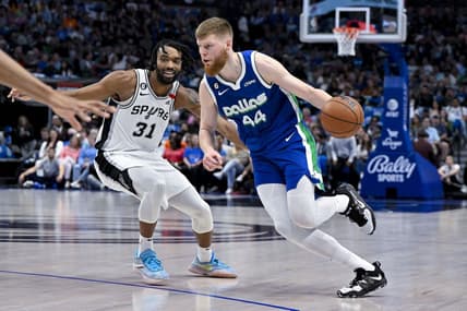 Apr 9, 2023; Dallas, Texas, USA; Dallas Mavericks forward Davis Bertans (44) drives to the basket past San Antonio Spurs forward Keita Bates-Diop (31) during the second quarter at the American Airlines Center. Mandatory Credit: Jerome Miron-USA TODAY Sports