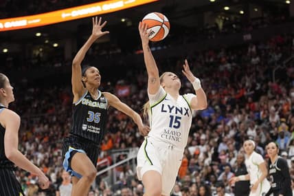 May 13, 2023; Toronto, Ontario, Canada; Minnesota Lynx guard Rachel Banham (15) goes up to make a basket as Chicago Sky guard Rebekah Gardner (35) pursues during the second half at Scotiabank Arena. Mandatory Credit: John E. Sokolowski-USA TODAY Sports