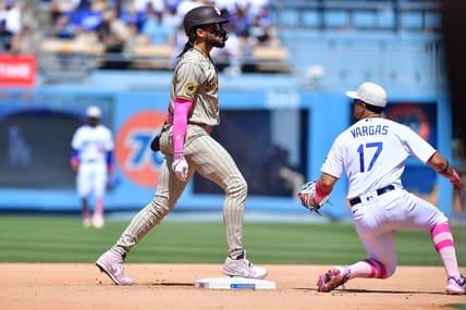 May 14, 2023; Los Angeles, California, USA; San Diego Padres right fielder Fernando Tatis Jr. (23) steals second against Los Angeles Dodgers second baseman Miguel Vargas (17) during the eighth inning at Dodger Stadium. Mandatory Credit: Gary A. Vasquez-USA TODAY Sports