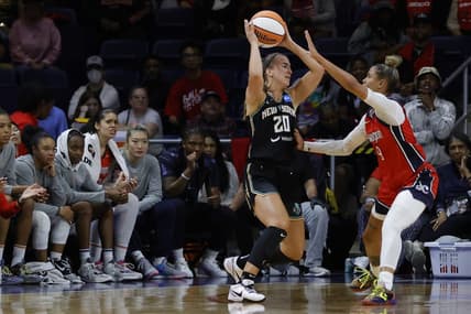 May 19, 2023; Washington, District of Columbia, USA; New York Liberty guard Sabrina Ionescu (20) holds the ball as Washington Mystics guard Natasha Cloud (9) defends at Entertainment & Sports Arena. Mandatory Credit: Geoff Burke-USA TODAY Sports
