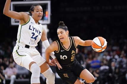 May 28, 2023; Las Vegas, Nevada, USA; Las Vegas Aces guard Kelsey Plum (10) drives the ball against Minnesota Lynx forward Napheesa Collier (24) during the third quarter at Michelob Ultra Arena. Mandatory Credit: Lucas Peltier-USA TODAY Sports