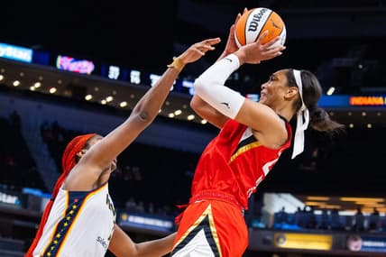 Jun 4, 2023; Indianapolis, Indiana, USA; Las Vegas Aces forward A'ja Wilson (22) shoots the ball while Indiana Fever center Aliyah Boston (7) defends in the second half at Gainbridge Fieldhouse. Mandatory Credit: Trevor Ruszkowski-USA TODAY Sports