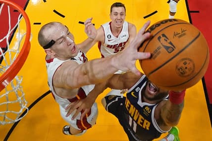 Jun 9, 2023; Miami, Florida, USA; Miami Heat center Cody Zeller (44) blocks the shot of Denver Nuggets forward Bruce Brown (11) during the first half in game four of the 2023 NBA Finals at Kaseya Center. Mandatory Credit: Kyle Terada-USA TODAY Sports