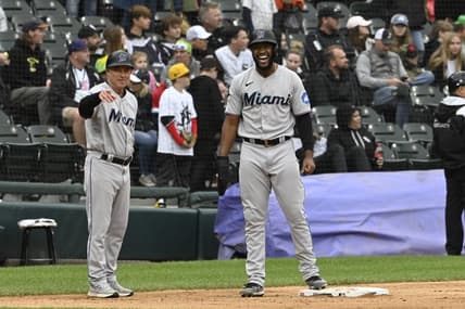 Jun 11, 2023; Chicago, Illinois, USA;  Miami Marlins left fielder Bryan De La Cruz (14) yells with Miami Marlins third base/infield coach Jody Reed (33) after hitting a two RBI double against the Chicago White Sox during the ninth inning at Guaranteed Rate Field. Mandatory Credit: Matt Marton-USA TODAY Sports