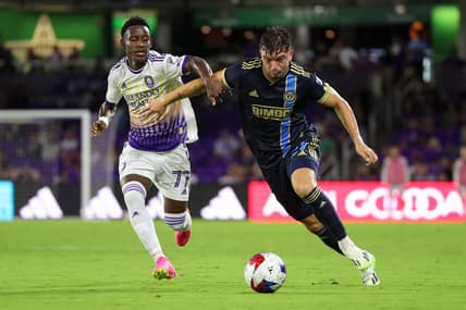 Jun 21, 2023; Orlando, Florida, USA;  Philadelphia Union defender Kai Wagner (27) controls the ball from Orlando City SC forward Ivan Angulo (77) in the second half at Exploria Stadium. Mandatory Credit: Nathan Ray Seebeck-USA TODAY Sports