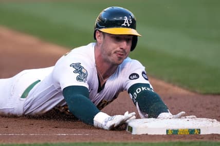 Jun 30, 2023; Oakland, California, USA; Oakland Athletics right fielder Brent Rooker (25) slides into third base for a triple against the Chicago White Sox during the third inning at Oakland-Alameda County Coliseum. Mandatory Credit: Darren Yamashita-USA TODAY Sports