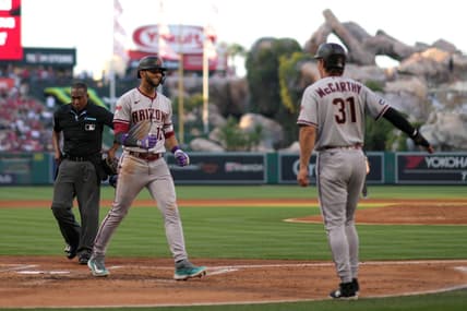 Jun 30, 2023; Anaheim, California, USA; Arizona Diamondbacks designated hitter Lourdes Gurriel Jr. (12) celebrates with right fielder Jake McCarthy (31) after hitting a grand slam home run in the second inning against the Los Angeles Angels at Angel Stadium. Mandatory Credit: Kirby Lee-USA TODAY Sports