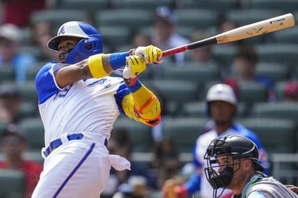 Jul 1, 2023; Cumberland, Georgia, USA; Atlanta Braves right fielder Ronald Acuna Jr. (13) hits a lead off home run against the Miami Marlins during the first inning at Truist Park. Mandatory Credit: Dale Zanine-USA TODAY Sports