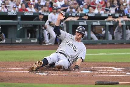 Jul 1, 2023; St. Louis, Missouri, USA; New York Yankees designated hitter DJ LeMahieu (26) slides in safely to home plate for a run against the St. Louis Cardinals in the first inning in game two of a double header at Busch Stadium. Mandatory Credit: Joe Puetz-USA TODAY Sports