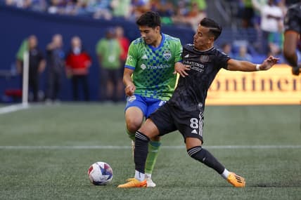 Jul 1, 2023; Seattle, Washington, USA; Houston Dynamo midfielder Amine Bassi (8) steals the ball from Seattle Sounders FC midfielder Obed Vargas (73) during the first half at Lumen Field. Mandatory Credit: Joe Nicholson-USA TODAY Sports