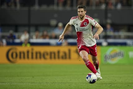 Jul 1, 2023; Cincinnati, Ohio, USA; New England Revolution midfielder Matt Polster (8) dribbles the ball against FC Cincinnati in the second half at TQL Stadium. Mandatory Credit: Aaron Doster-USA TODAY Sports