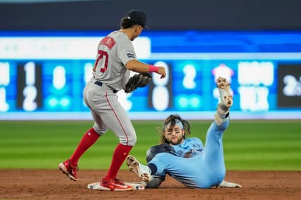 Jul 2, 2023; Toronto, Ontario, CAN; Toronto Blue Jays shortstop Bo Bichette (11) is tagged out at second by Boston Red Sox shortstop David Hamilton (70) during the third inning at Rogers Centre. Mandatory Credit: Kevin Sousa-USA TODAY Sports