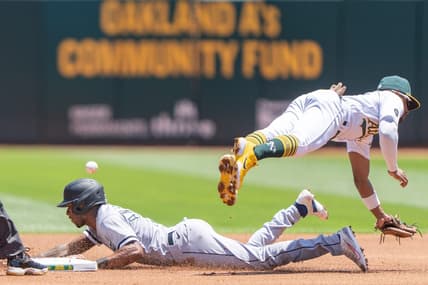 Jul 2, 2023; Oakland, California, USA;  Oakland Athletics second baseman Tony Kemp (5) misses the ball against Chicago White Sox shortstop Tim Anderson (7) during the first inning at Oakland-Alameda County Coliseum. Mandatory Credit: Stan Szeto-USA TODAY Sports