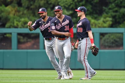 Jul 2, 2023; Philadelphia, Pennsylvania, USA;  Washington Nationals center fielder Derek Hill (34), left fielder Stone Garrett (36) and right fielder Lane Thomas (28) celebrate win  against the Philadelphia Phillies at Citizens Bank Park. Mandatory Credit: Eric Hartline-USA TODAY Sports