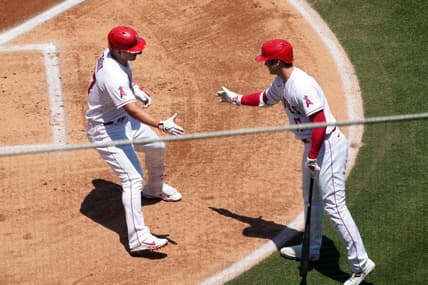 Jul 2, 2023; Anaheim, California, USA; Los Angeles Angels center fielder Mike Trout (27) celebrates with starting pitcher Shohei Ohtani (17) after hitting a solo home run in the first inning against the Arizona Diamondbacks at Angel Stadium. Mandatory Credit: Kirby Lee-USA TODAY Sports