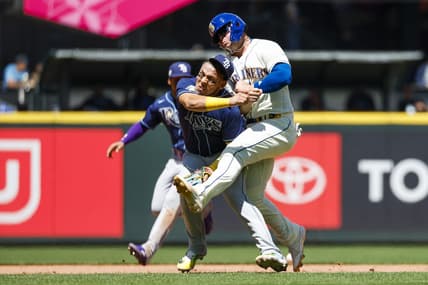 Jul 2, 2023; Seattle, Washington, USA; Tampa Bay Rays third baseman Isaac Paredes (17) collides with Seattle Mariners first baseman Ty France (23) while attempting to field a ground ball during the third inning at T-Mobile Park. Mandatory Credit: Joe Nicholson-USA TODAY Sports