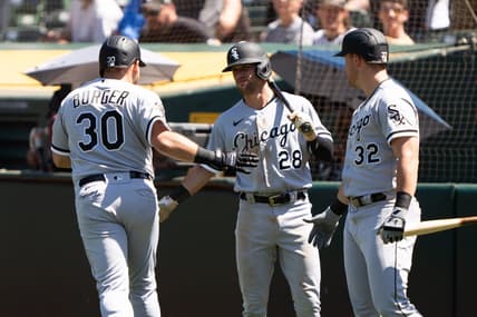 Jul 2, 2023; Oakland, California, USA;  Chicago White Sox third baseman Jake Burger (30) celebrates with shortstop Zach Remillard (28) and  right fielder Gavin Sheets (32) after hitting a solo home run during the seventh inning against the Oakland Athletics at Oakland-Alameda County Coliseum. Mandatory Credit: Stan Szeto-USA TODAY Sports