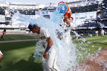 Jul 3, 2023; Milwaukee, Wisconsin, USA;  Milwaukee Brewers Jahmai Jones (12) is dunked with Gatorade by shortstop Willy Adames (27) following the game against the Chicago Cubs at American Family Field. Mandatory Credit: Jeff Hanisch-USA TODAY Sports