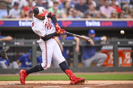 Jul 3, 2023; Minneapolis, Minnesota, USA;  Minnesota Twins designated hitter Byron Buxton (25) hits a sacrifice RBI against the Kansas City Royals during the first inning at Target Field. Mandatory Credit: Nick Wosika-USA TODAY Sports