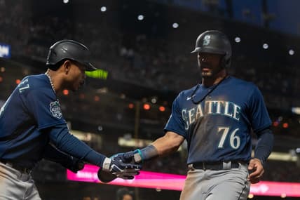 Jul 3, 2023; San Francisco, California, USA;  Seattle Mariners center fielder Julio Rodriguez (44) celebrates with  second baseman Jose Caballero (76) during the ninth inning against the San Francisco Giants at Oracle Park. Mandatory Credit: Stan Szeto-USA TODAY Sports