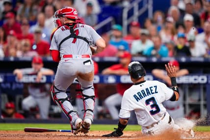 Jul 4, 2023; Miami, Florida, USA; Miami Marlins second baseman Luis Arraez (3) is forced out at home by St. Louis Cardinals catcher Andrew Knizner (7) during the fourth inning at loanDepot Park. Mandatory Credit: Rich Storry-USA TODAY Sports