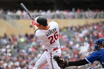 Jul 4, 2023; Minneapolis, Minnesota, USA; Minnesota Twins right fielder Max Kepler (26) hits a two-run home run off Kansas City Royals starting pitcher Zack Greinke (not pictured) during the third inning as catcher Salvador Perez (13) looks on at Target Field. Mandatory Credit: Jeffrey Becker-USA TODAY Sports