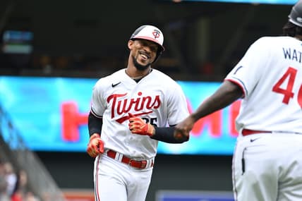 Jul 4, 2023; Minneapolis, Minnesota, USA; Minnesota Twins designated hitter Byron Buxton (25) reacts with third base coach Tommy Watkins (40) after hitting a home run off Kansas City Royals starting pitcher Zack Greinke (not pictured) during the fifth inning at Target Field. Mandatory Credit: Jeffrey Becker-USA TODAY Sports