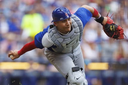Jul 4, 2023; Milwaukee, Wisconsin, USA;  Chicago Cubs catcher Miguel Amaya (6) underhands the ball towards first base  during the sixth inning against the Milwaukee Brewers at American Family Field. Mandatory Credit: Jeff Hanisch-USA TODAY Sports