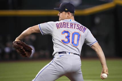 Jul 4, 2023; Phoenix, Arizona, USA; New York Mets relief pitcher David Robertson (30) pitches against the Arizona Diamondbacks during the ninth inning at Chase Field. Mandatory Credit: Joe Camporeale-USA TODAY Sports