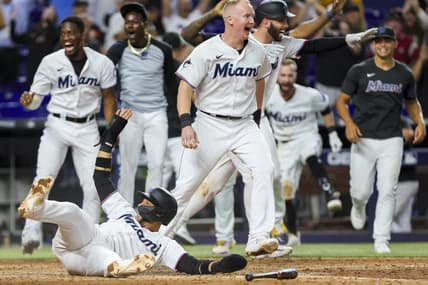 Jul 5, 2023; Miami, Florida, USA; Miami Marlins first baseman Yuli Gurriel (10) scores the winning run against the St. Louis Cardinals as Miami Marlins players celebrate during the ninth inning at loanDepot Park. Mandatory Credit: Sam Navarro-USA TODAY Sports