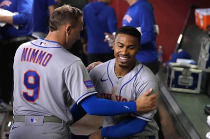 Jul 6, 2023; Phoenix, Arizona, USA; New York Mets shortstop Francisco Lindor (12) celebrates with New York Mets center fielder Brandon Nimmo (9) after scoring a run against the Arizona Diamondbacks during the third inning at Chase Field. Mandatory Credit: Joe Camporeale-USA TODAY Sports