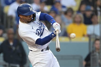 Jul 7, 2023; Los Angeles, California, USA; Los Angeles Dodgers right fielder Mookie Betts (50) hits a solo home run in the third inning against the Los Angeles Angels at Dodger Stadium. Mandatory Credit: Jayne Kamin-Oncea-USA TODAY Sports
