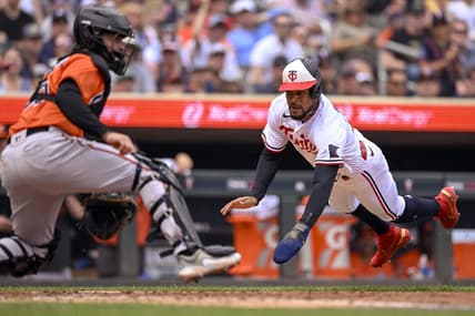 Jul 8, 2023; Minneapolis, Minnesota, USA; Minnesota Twins designated hitter Byron Buxton (25) dives for the plate and scores a run against the Baltimore Orioles during the sixth inning at Target Field. Mandatory Credit: Nick Wosika-USA TODAY Sports