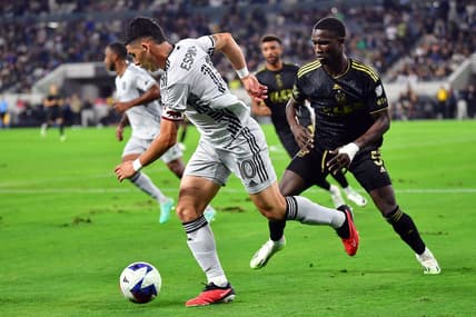 July 8, 2023; Los Angeles, California, USA; San Jose Earthquakes forward Cristian Espinoza (10) moves the ball against Los Angeles FC defender Mamadou Fall (5) during the first half at BMO Stadium. Mandatory Credit: Gary A. Vasquez-USA TODAY Sports